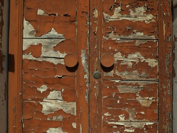 Photo of Old door with shabby paint outdoors, closeup