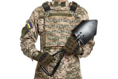Soldier in Ukrainian military uniform with folding sapper shovel on white background, closeup