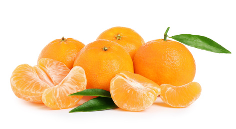 Fresh juicy tangerines with green leaves isolated on white