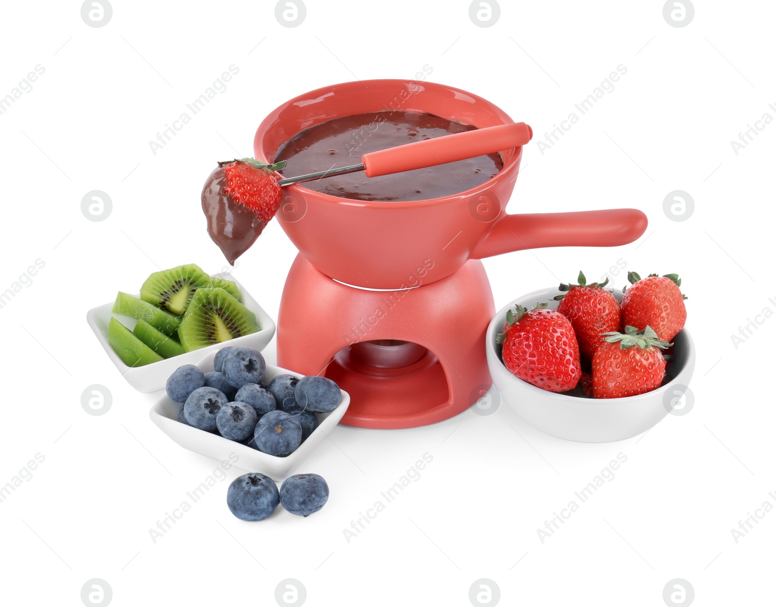 Photo of Fondue pot with melted chocolate, fresh berries, kiwi and fork isolated on white