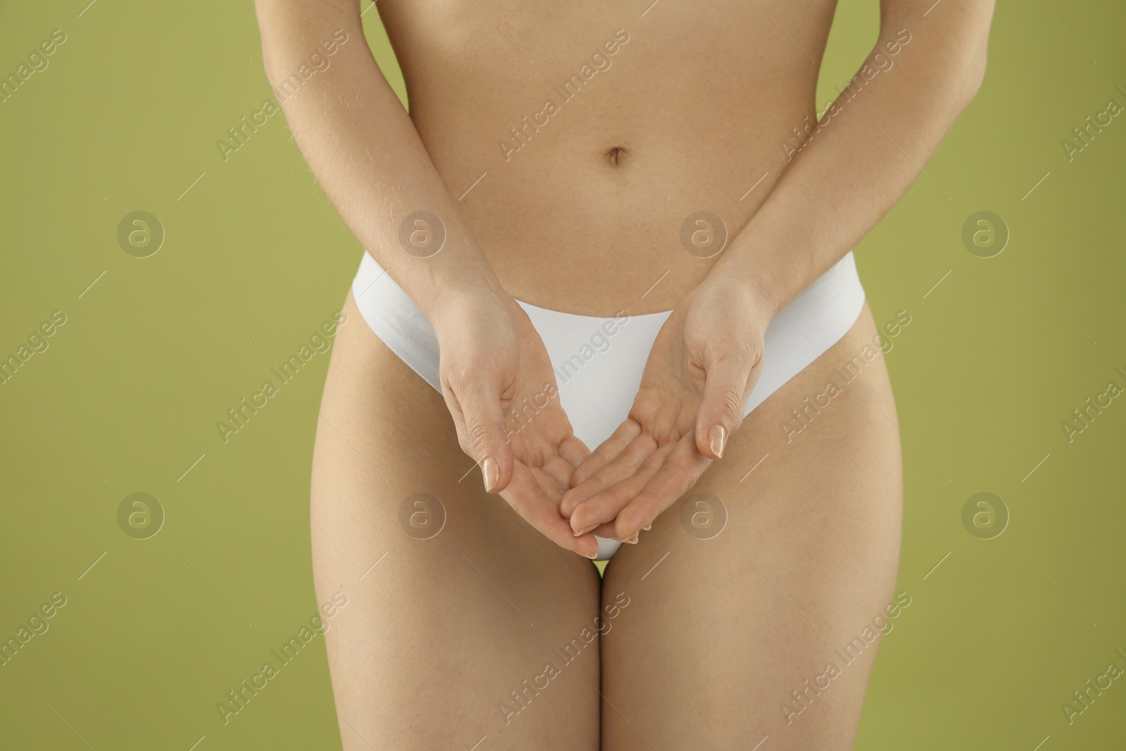 Photo of Gynecology. Woman in underwear on green background, closeup