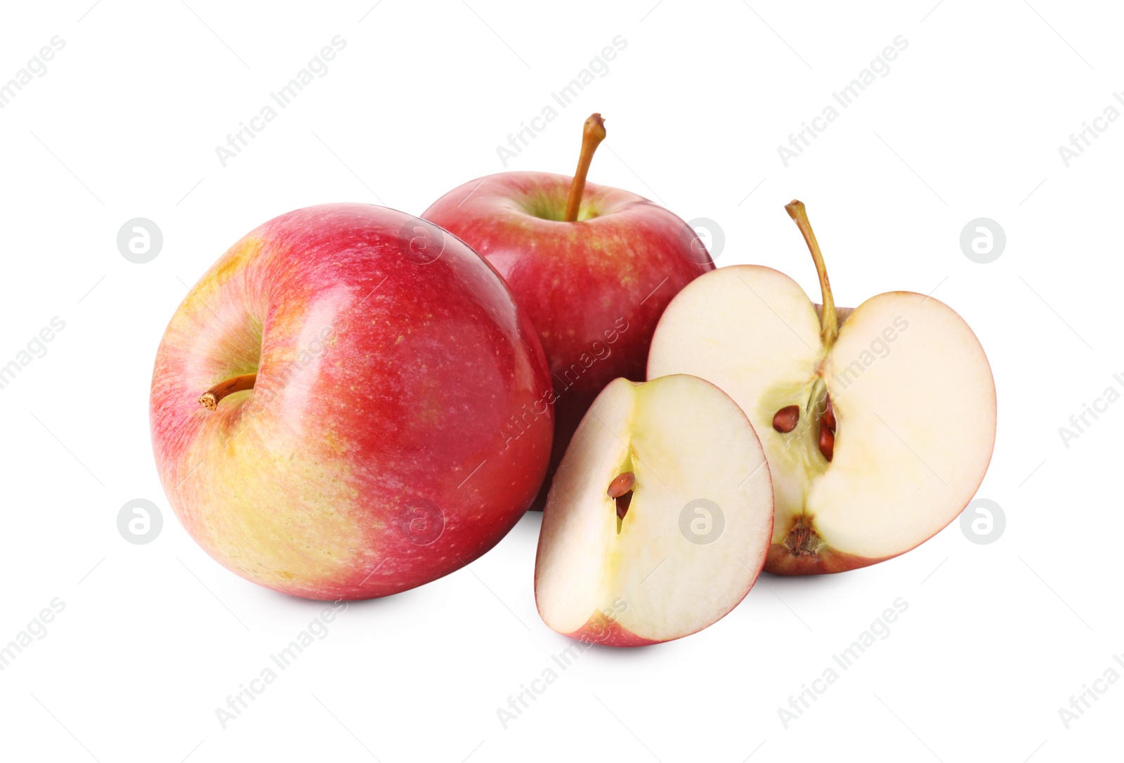 Photo of Whole and cut red apples isolated on white