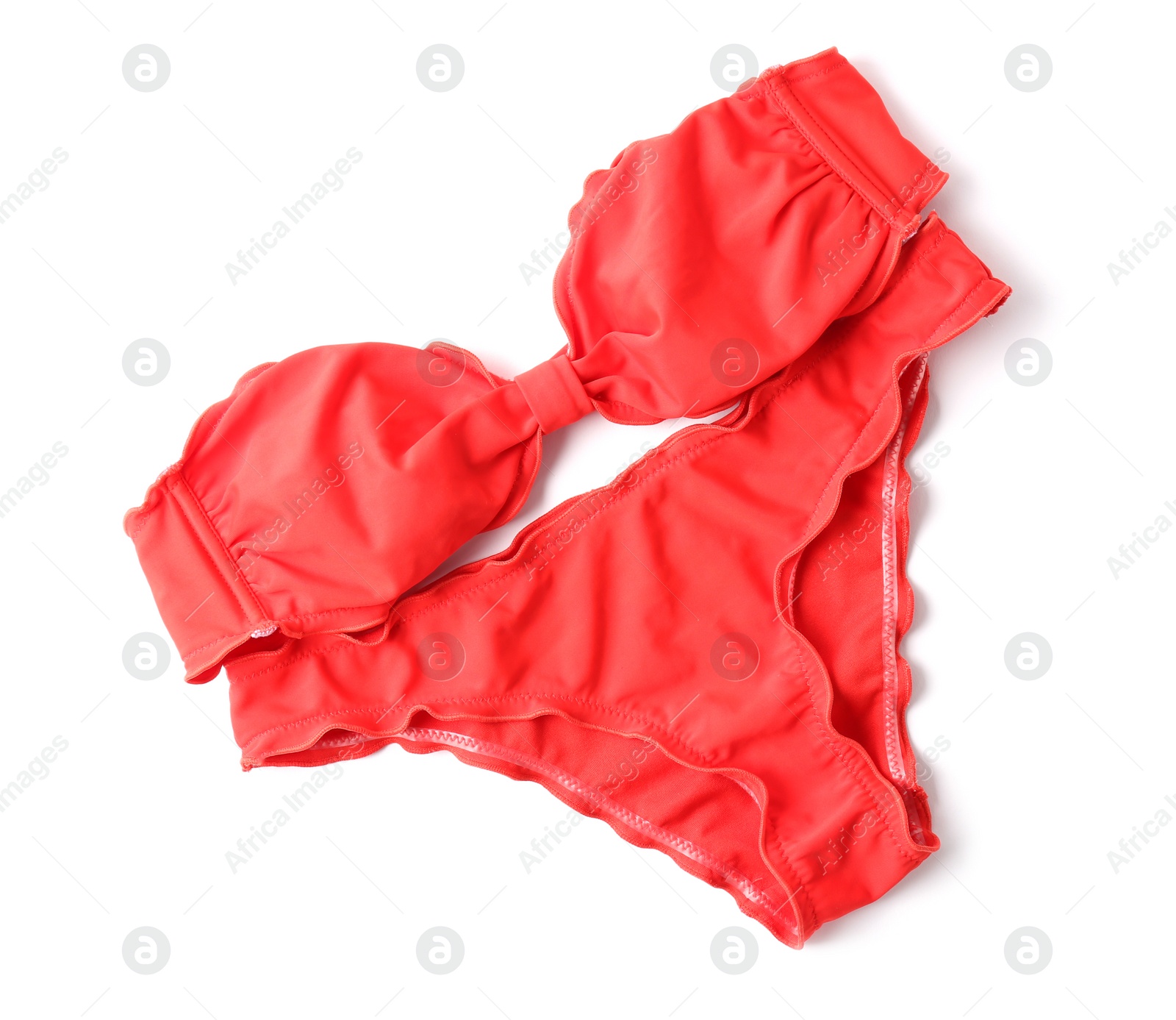 Photo of Bright swimsuit on white background, top view. Beach accessories