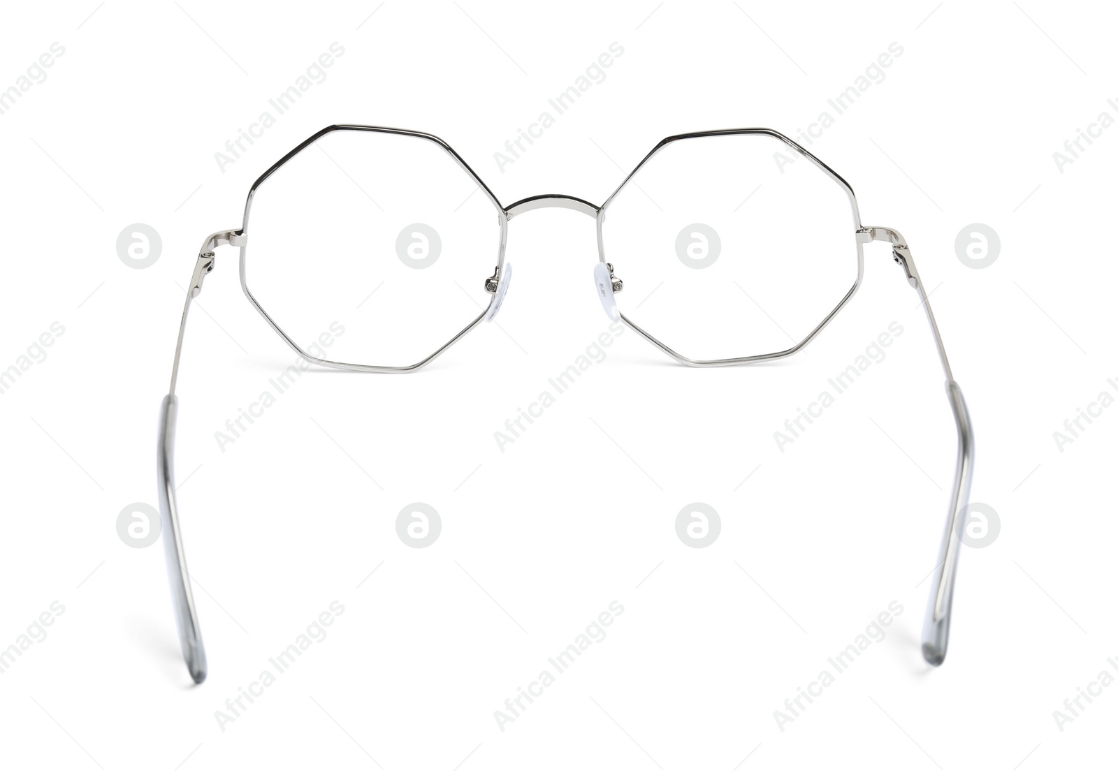 Photo of Stylish glasses with metal frame isolated on white