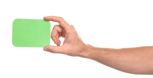 Photo of Man holding green card on white background, closeup of hand