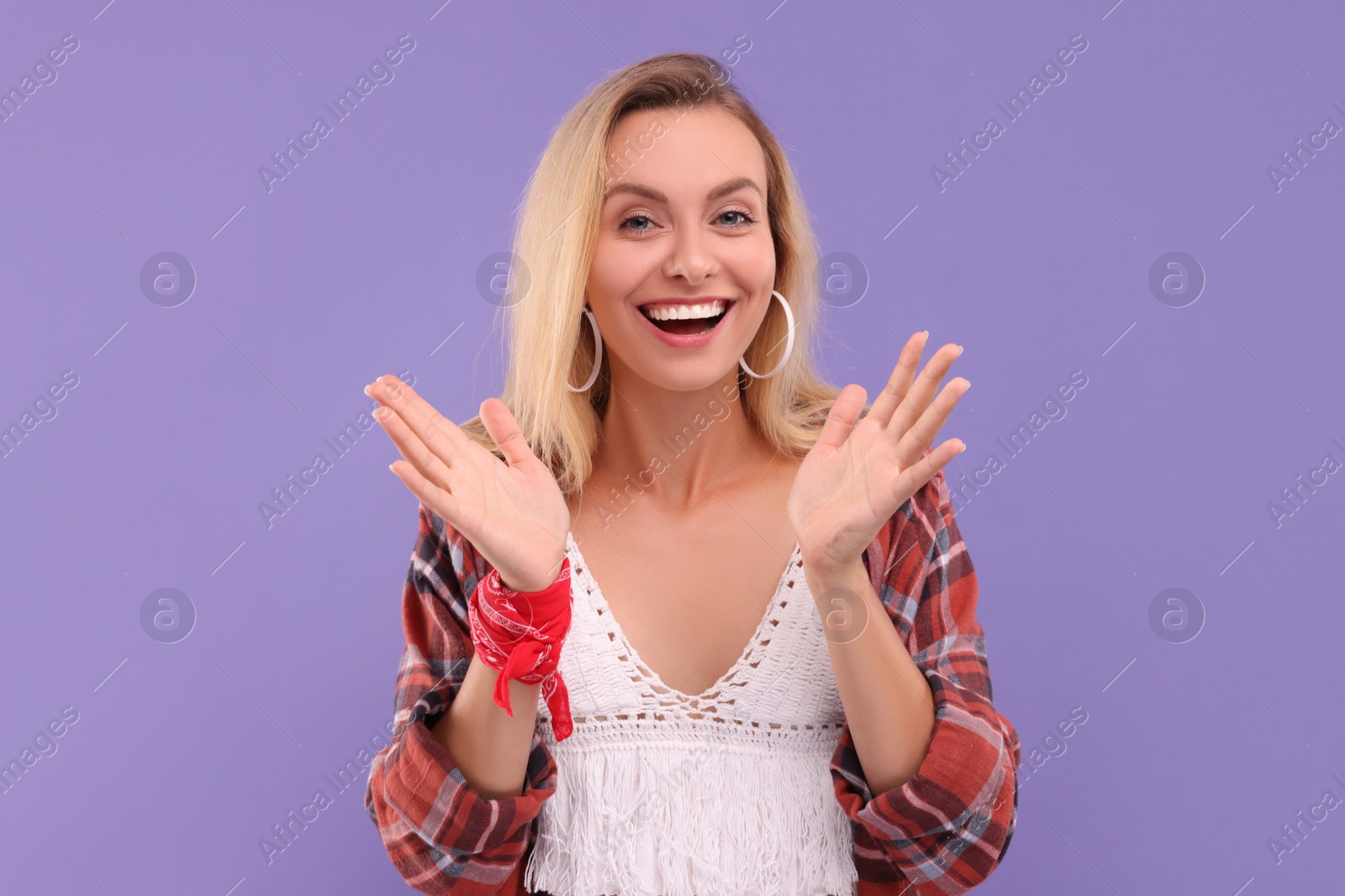 Photo of Portrait of happy hippie woman on purple background