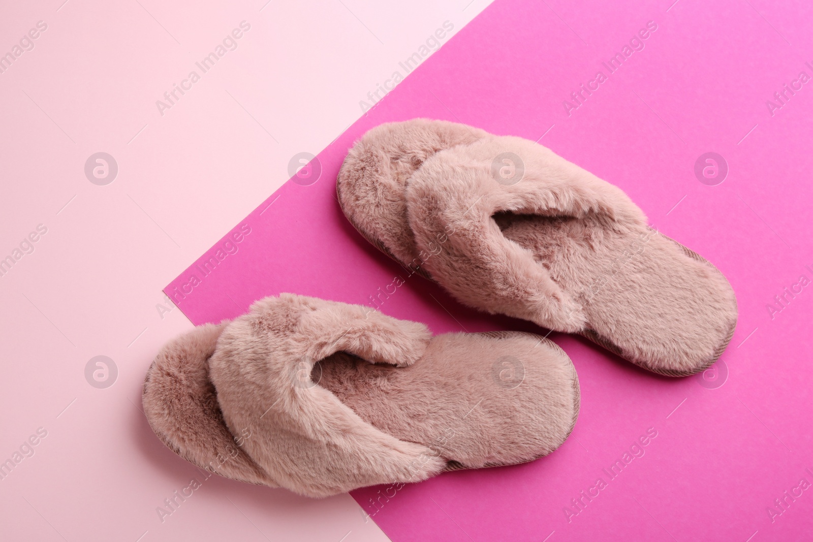 Photo of Pair of stylish soft slippers on color background, flat lay