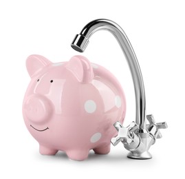 Photo of Water scarcity concept. Piggy bank and tap isolated on white