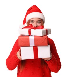Photo of Young woman in red sweater and Santa hat with Christmas gifts on white background