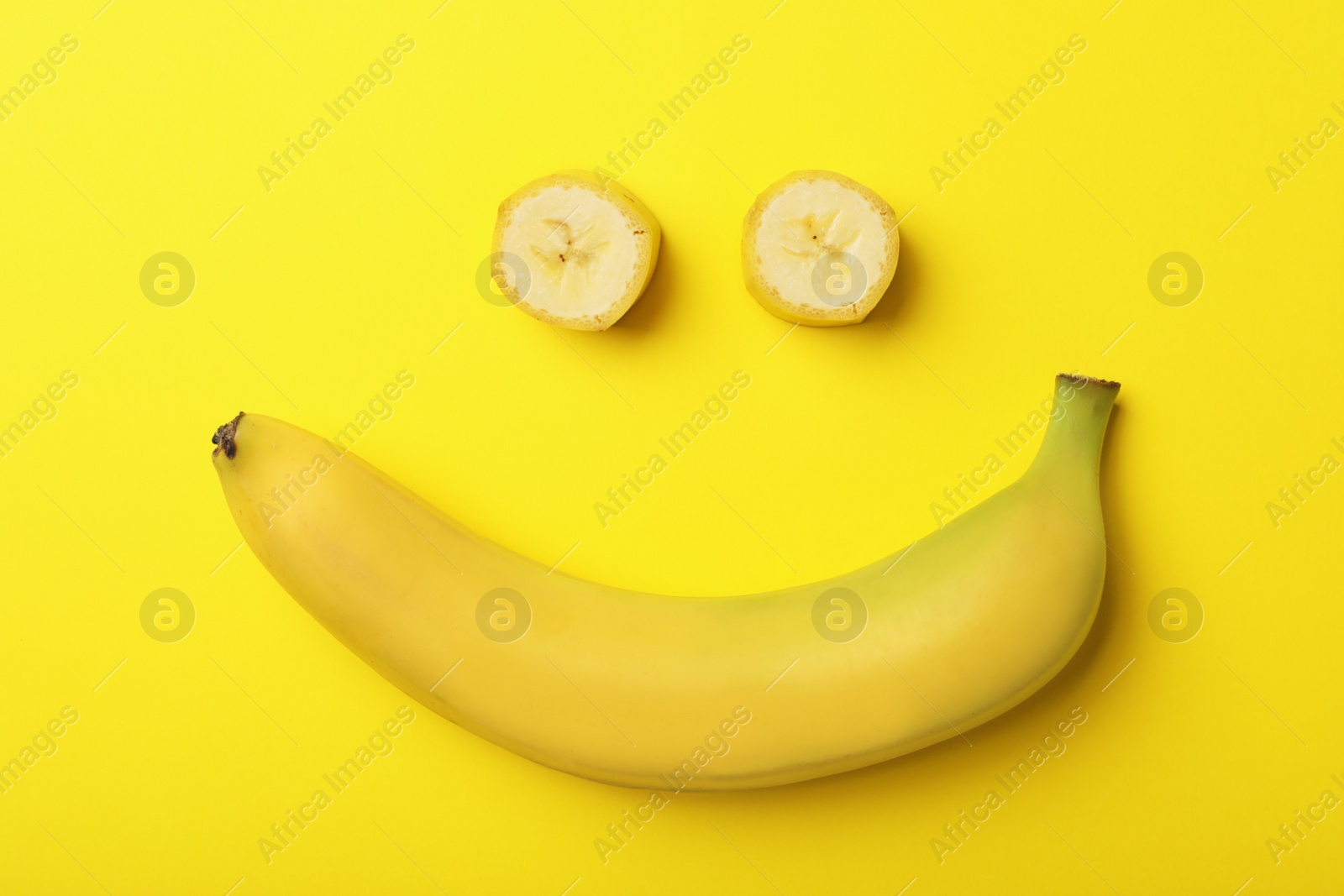 Photo of Funny flat lay composition with bananas on color background