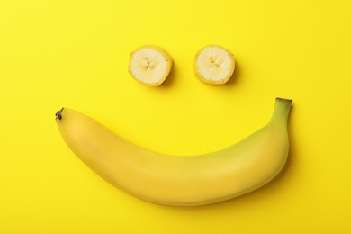 Photo of Funny flat lay composition with bananas on color background