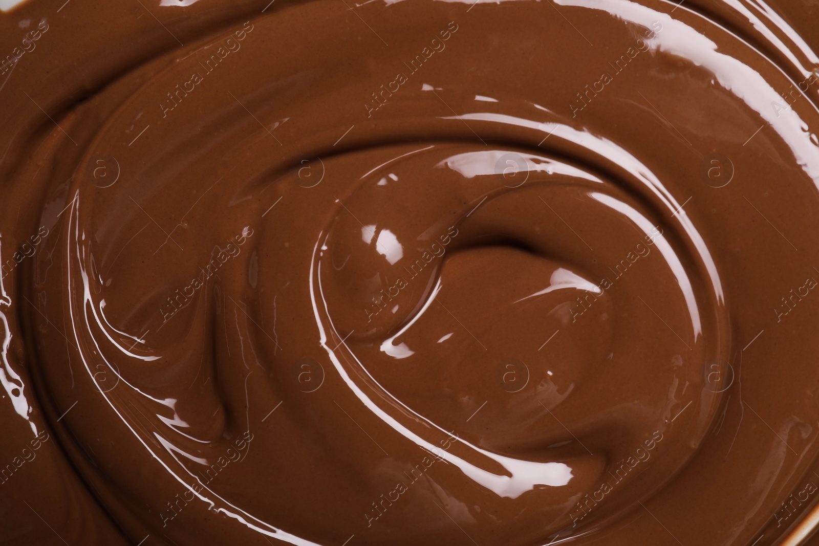 Photo of Tasty chocolate paste as background, closeup view