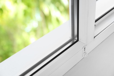 Photo of Modern window indoors, closeup view. Home interior