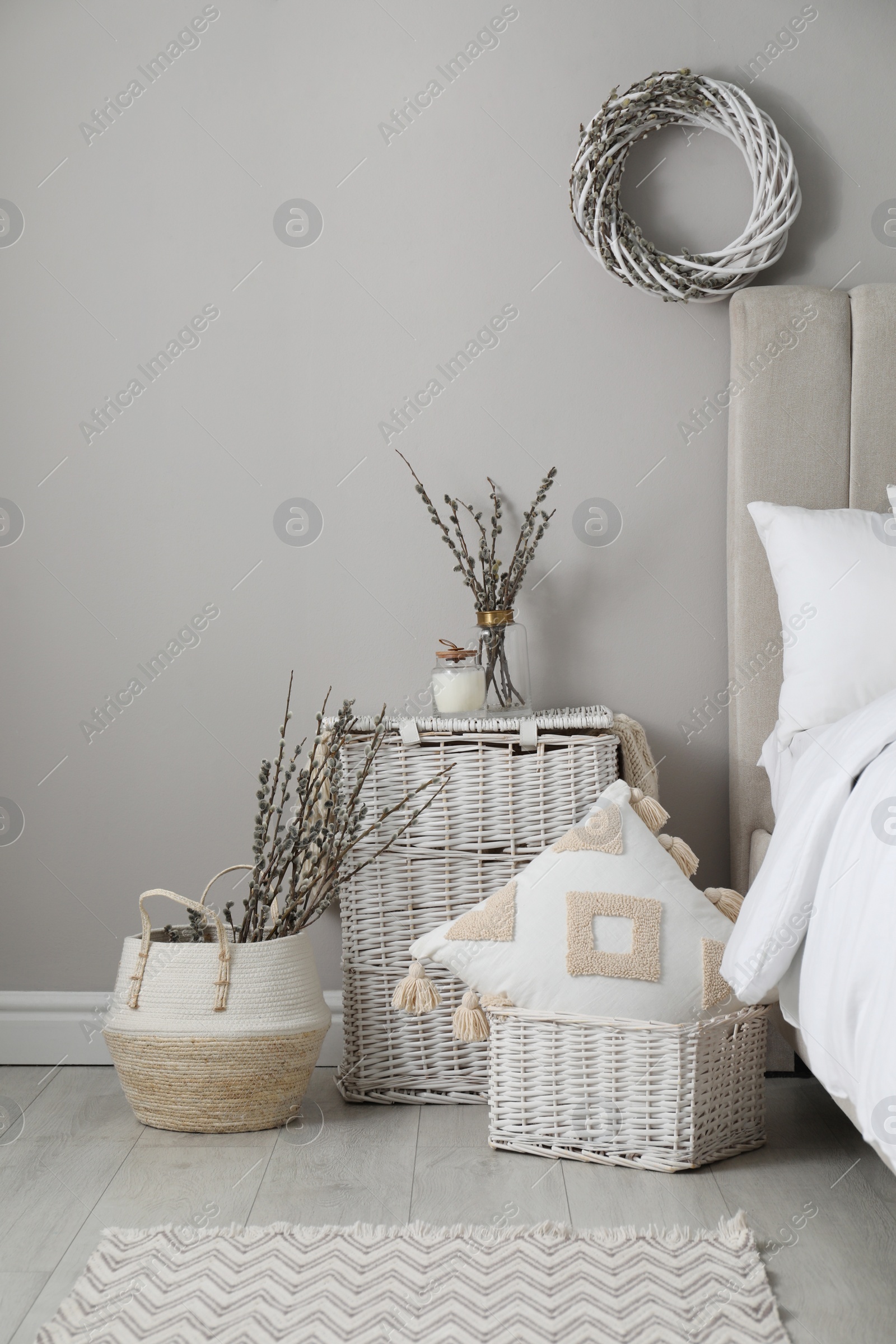 Photo of Bedroom interior with pussy willow branches and other decor