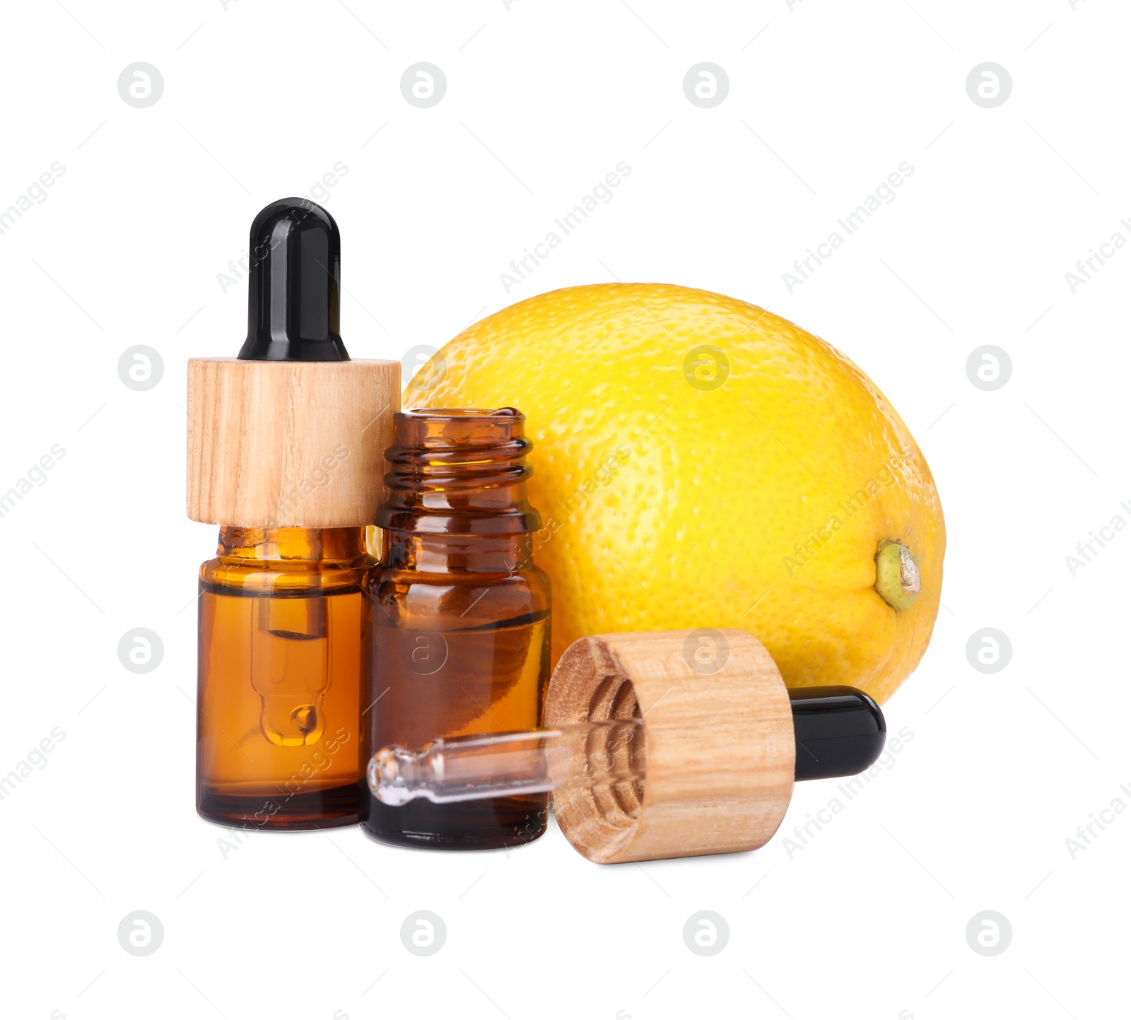 Photo of Bottles of citrus essential oil and fresh lemon isolated on white