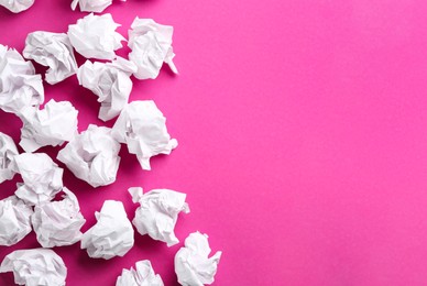 Photo of Crumpled sheets of paper on pink background, flat lay. Space for text