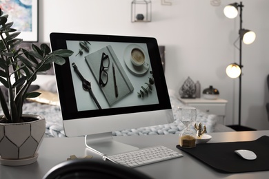 Photo of Stylish workplace interior with modern computer on desk