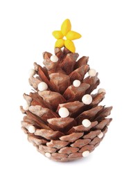 Photo of Christmas tree made from pine cone and plasticine on white background. Children's handmade ideas