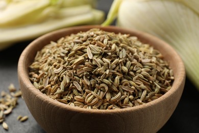 Fennel seeds in bowl on table, closeup