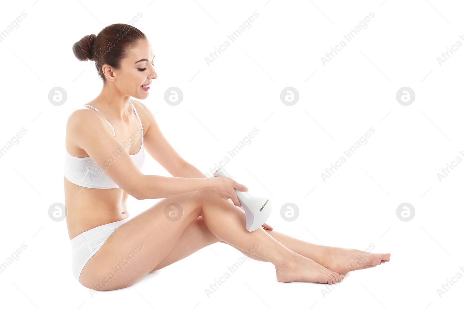 Photo of Woman doing leg epilation procedure isolated on white