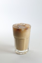 Photo of Iced coffee in glass on white background