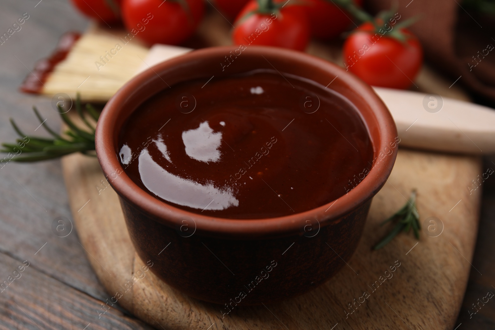 Photo of Marinade in bowl on wooden table, closeup
