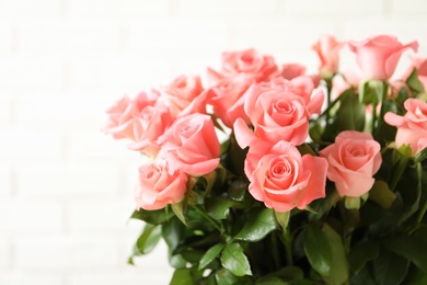 Photo of Bouquet of beautiful roses on blurred background