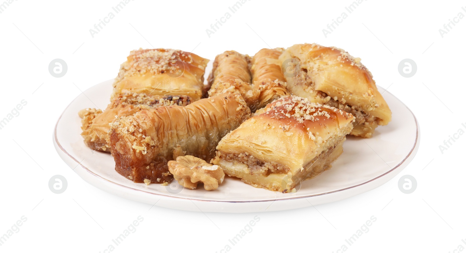 Photo of Eastern sweets. Pieces of tasty baklava isolated on white