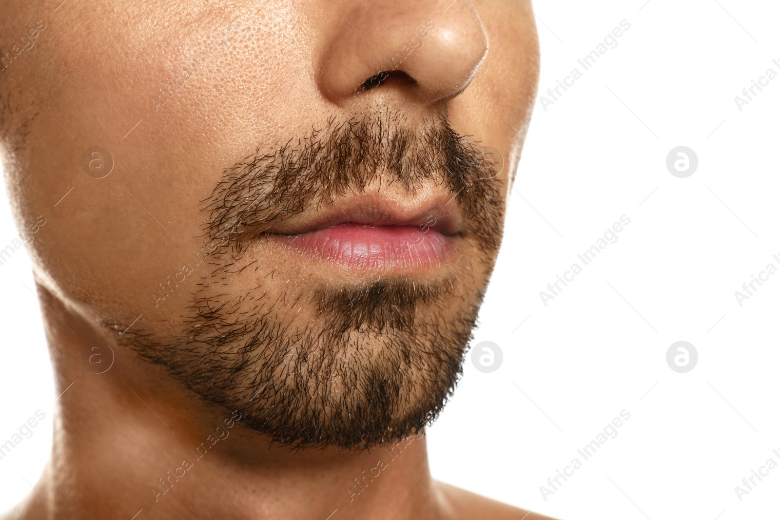 Photo of Young man with cold sore on lips against white background, closeup