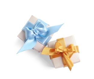 Photo of Beautifully wrapped gift boxes on white background, top view