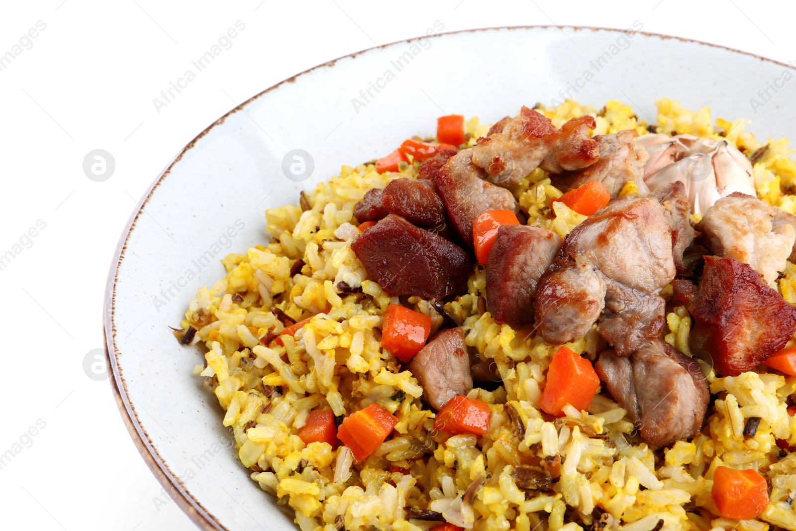 Photo of Delicious pilaf with meat, carrot and garlic isolated on white