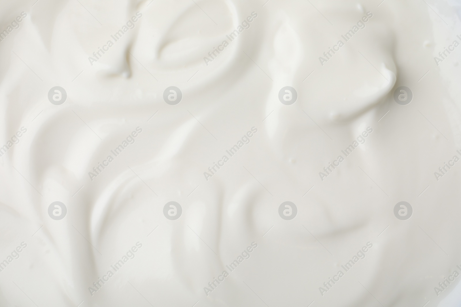 Photo of Delicious natural yogurt as background, top view