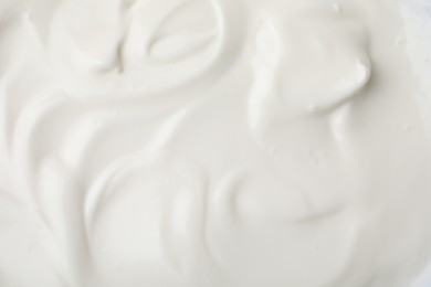 Photo of Delicious natural yogurt as background, top view