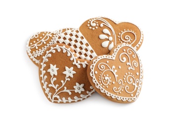 Gingerbread hearts decorated with icing on white background