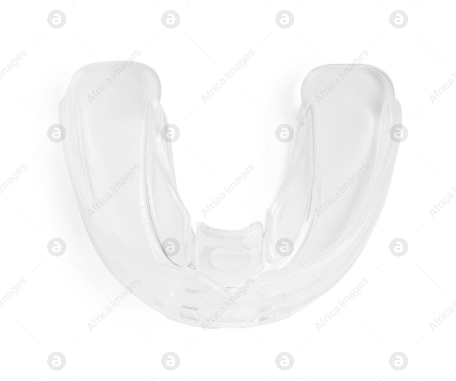 Photo of Transparent dental mouth guard isolated on white, top view. Bite correction