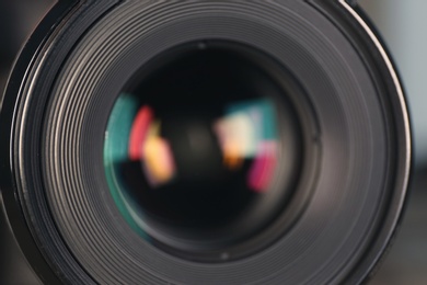 Photo of Camera lens of professional photographer, closeup view