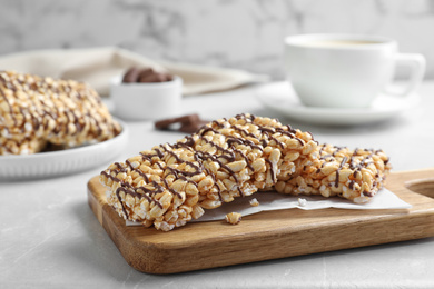 Photo of Delicious rice crispy treats on grey table