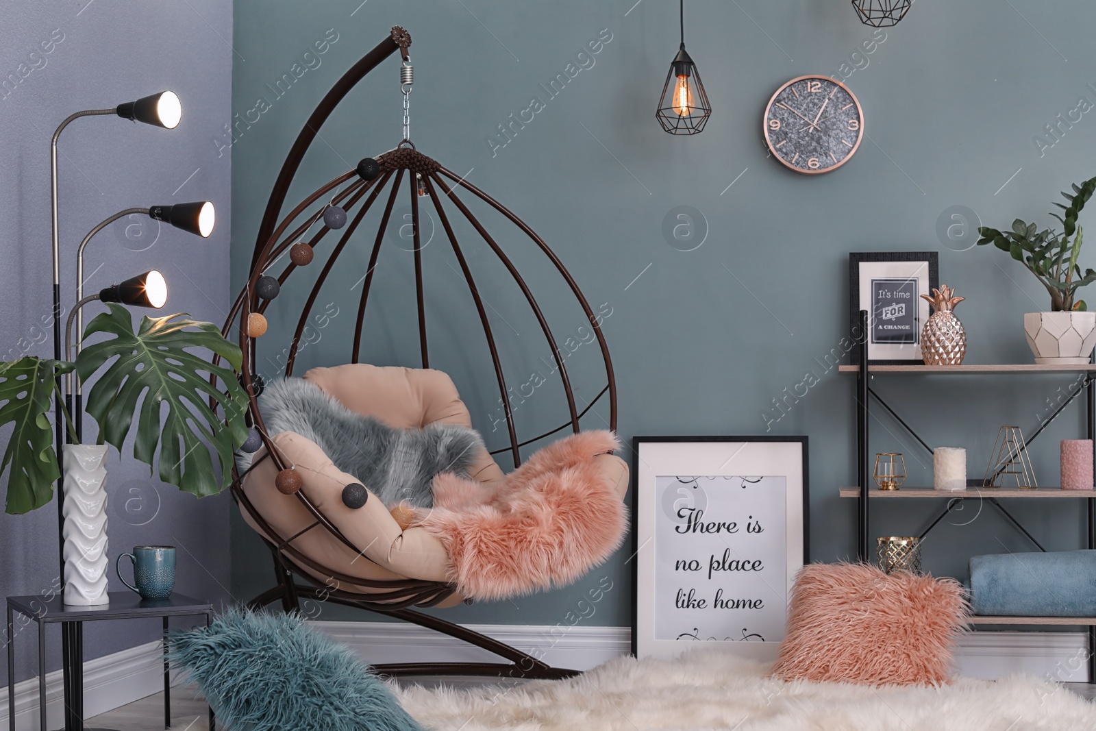 Photo of Elegant living room interior with hanging armchair and fuzzy rug