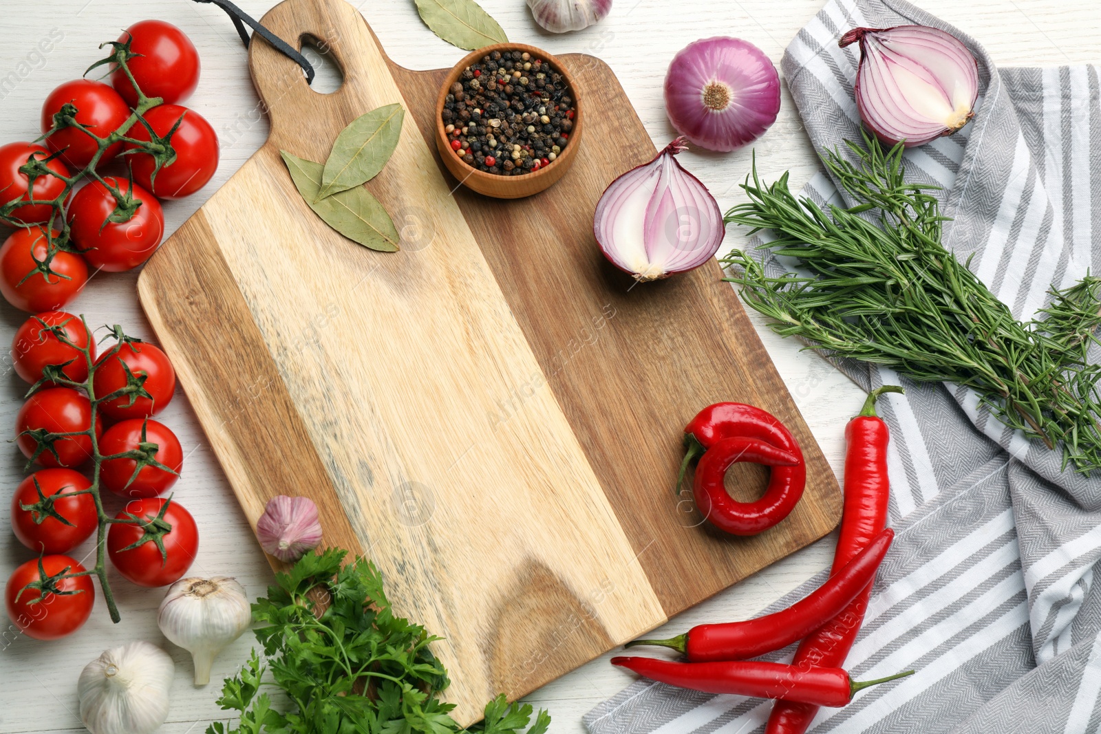 Photo of Cutting board on white wooden table, flat lay. Cooking utensil