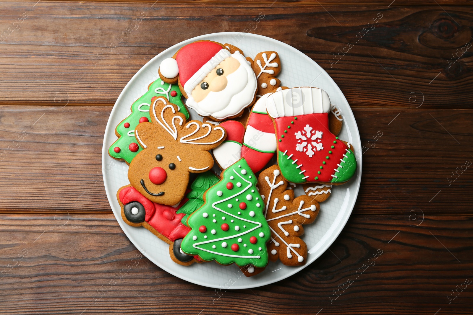 Photo of Different tasty Christmas cookies on wooden table, top view