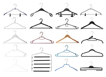 Image of Set with different empty hangers on white background