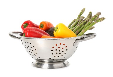 Photo of Metal colander with fresh peppers, asparagus and avocado isolated on white