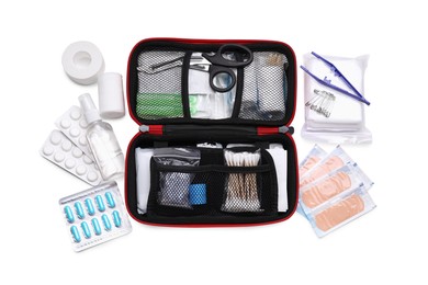 Photo of First aid kit, scissors, pins, cotton buds, pills, plastic forceps, hand sanitizer, medical plasters and elastic bandage isolated on white, top view