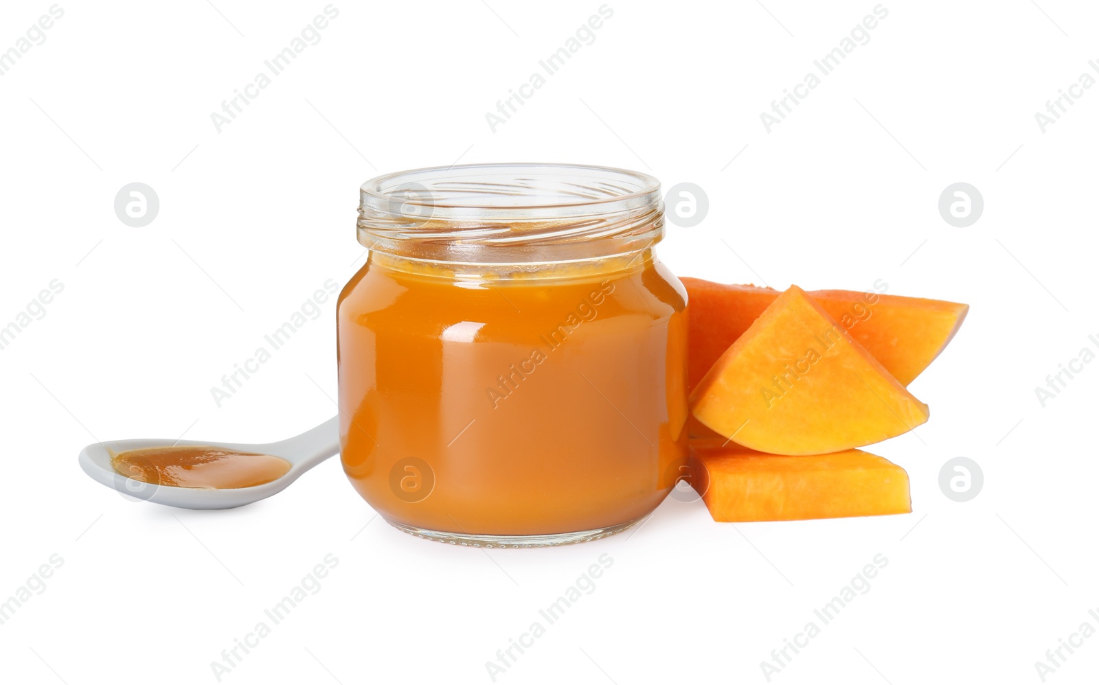 Photo of Tasty baby food in jar, spoon and fresh pumpkin isolated on white