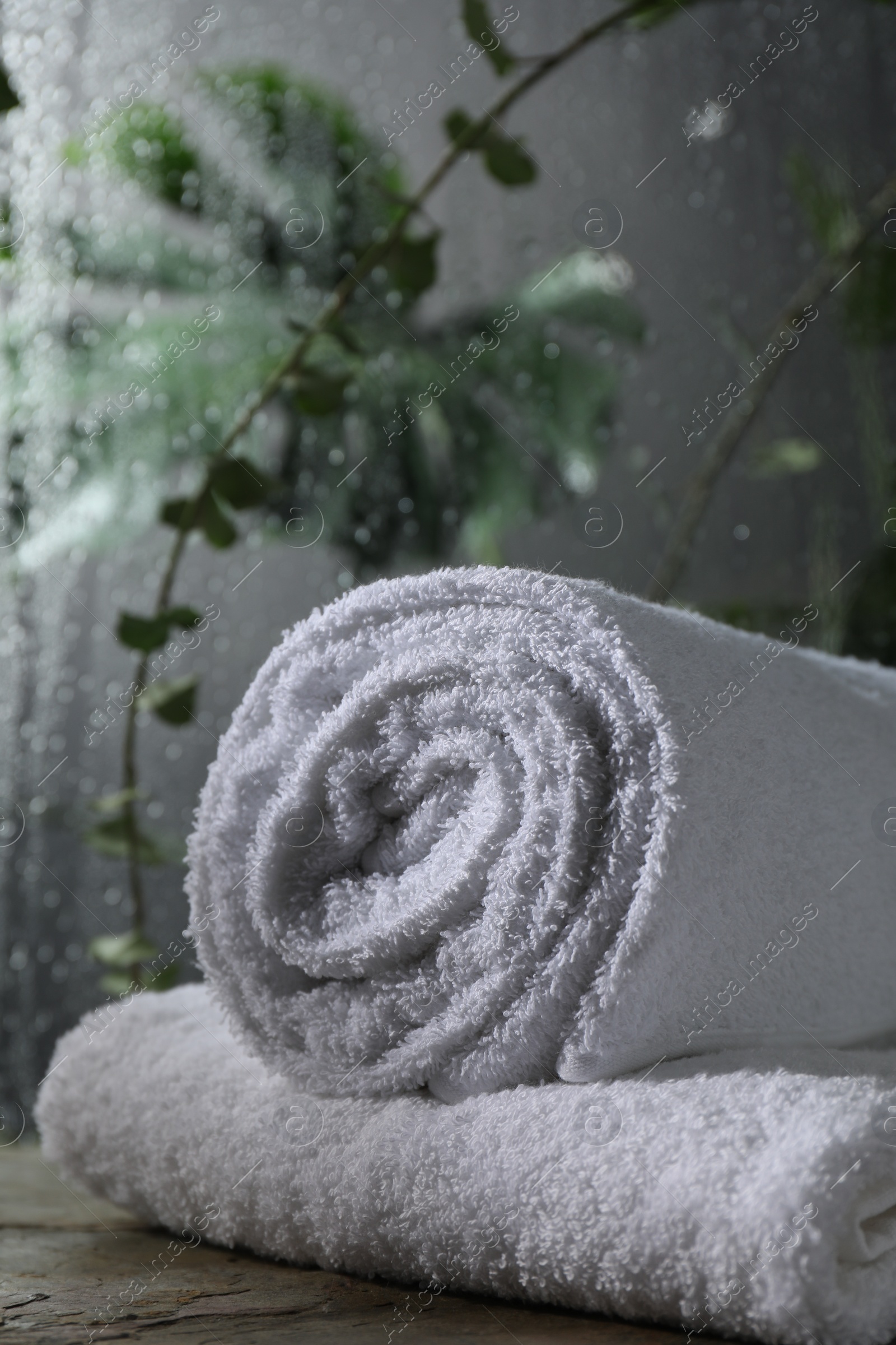 Photo of White terry towels on table in bathroom