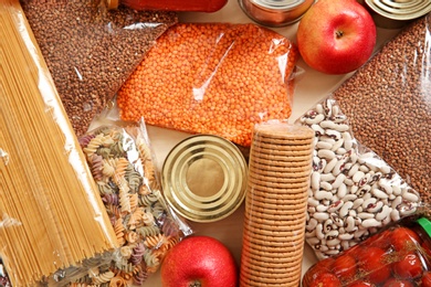 Photo of Many different products on table, top view. Food donation