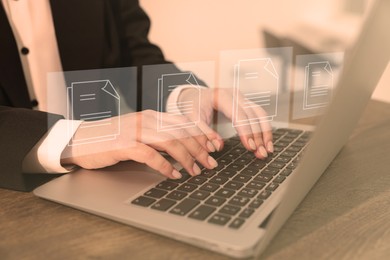 Image of Electronic document management. Woman working on laptop at table, closeup