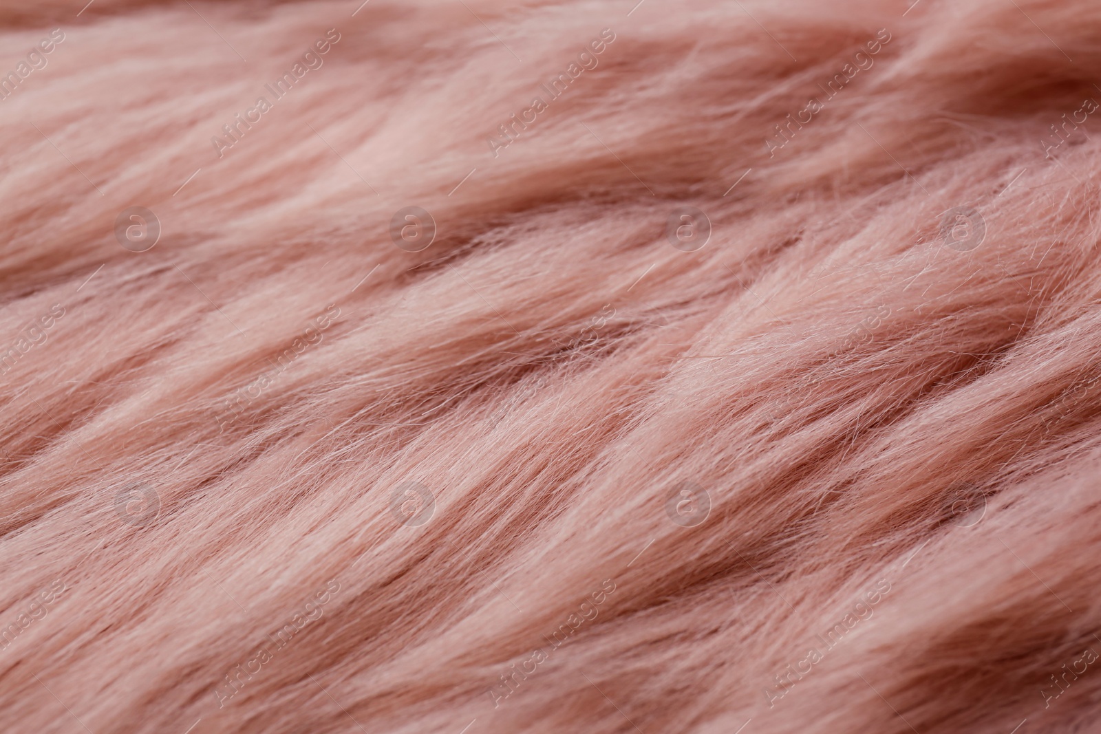 Photo of Pink faux fur as background, closeup view