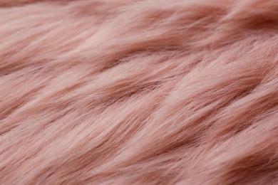 Photo of Pink faux fur as background, closeup view