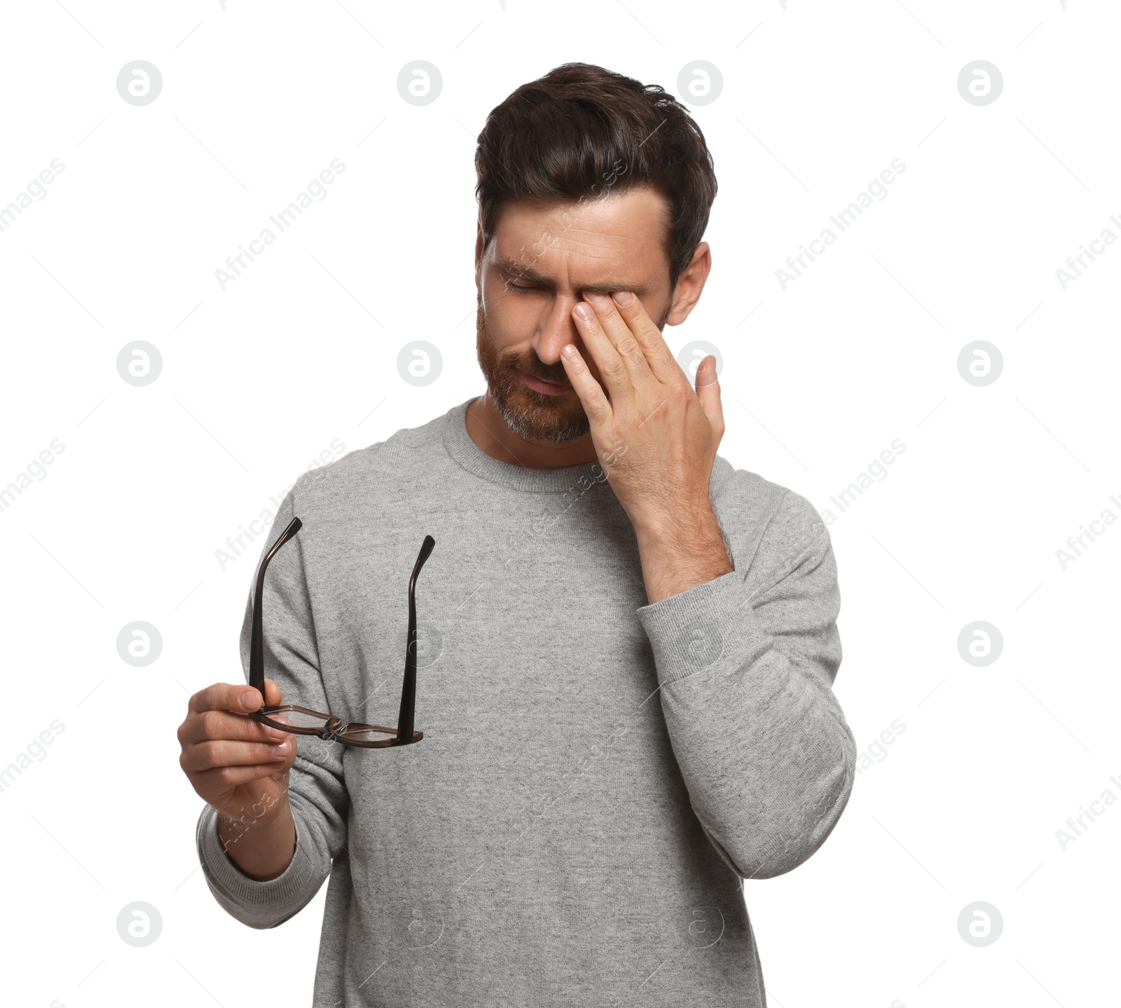 Photo of Man suffering from eyestrain on white background